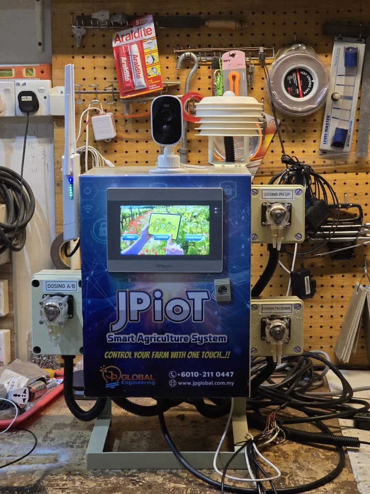 A JPIoT controller wired up on a workshop board with its sensors