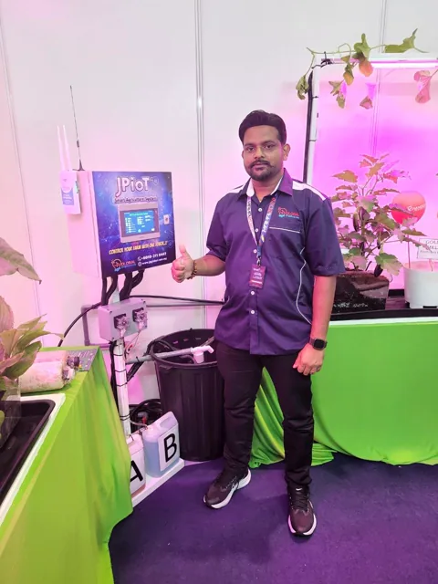 The JPIoT stand at MAHA 2022, with the system screen and indoor growing lights