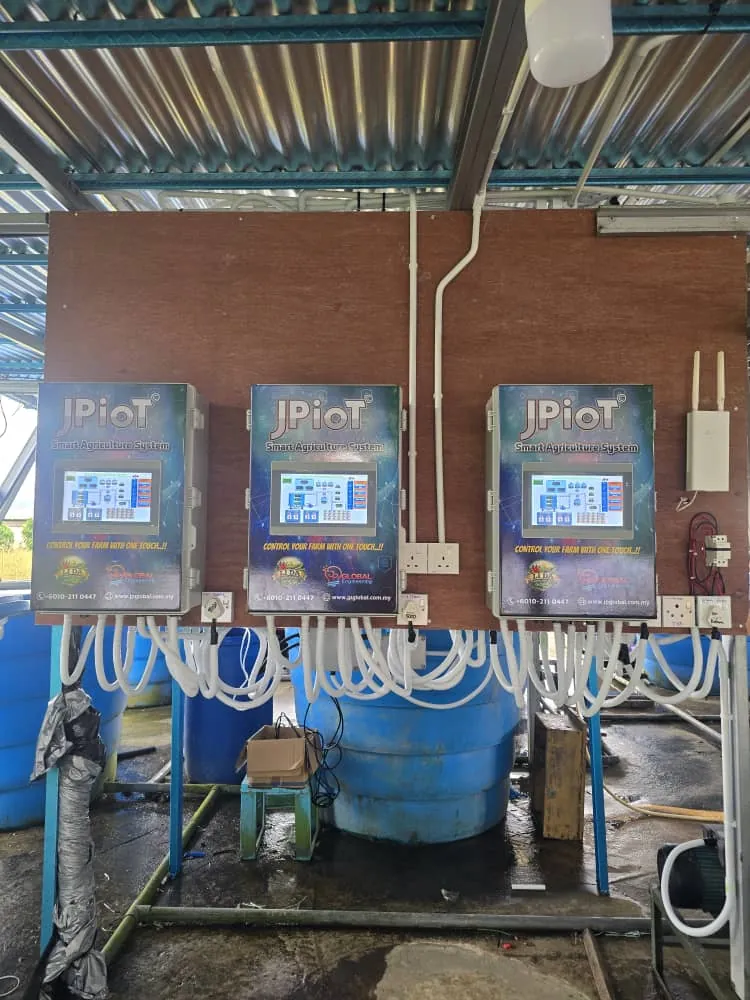 Three JPIoT controllers mounted above an irrigation manifold